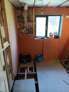 Flooring the space ready for bathroom tiles12